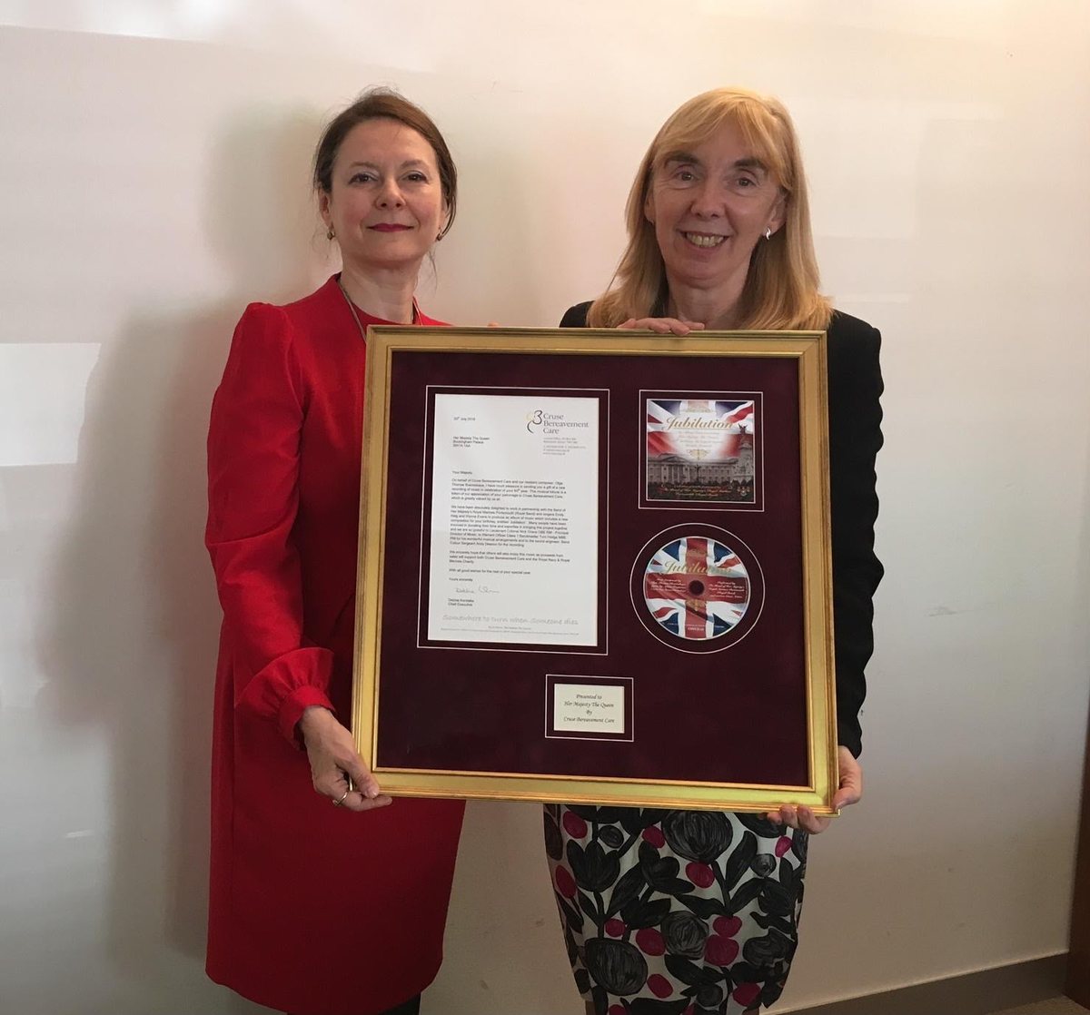 Dr. Olga Thomas with Debbie Kerslake of Cruse and the framed Jubilation gift