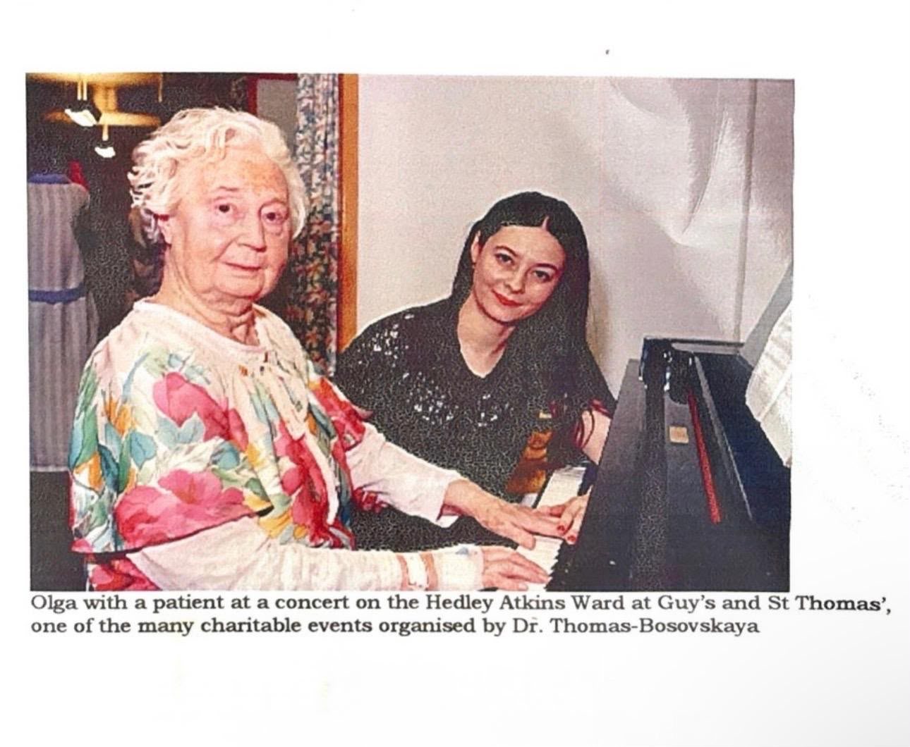 Dr. Olga Thomas performing for a patient on the Hedley Atkins Ward, Guy's Hospital